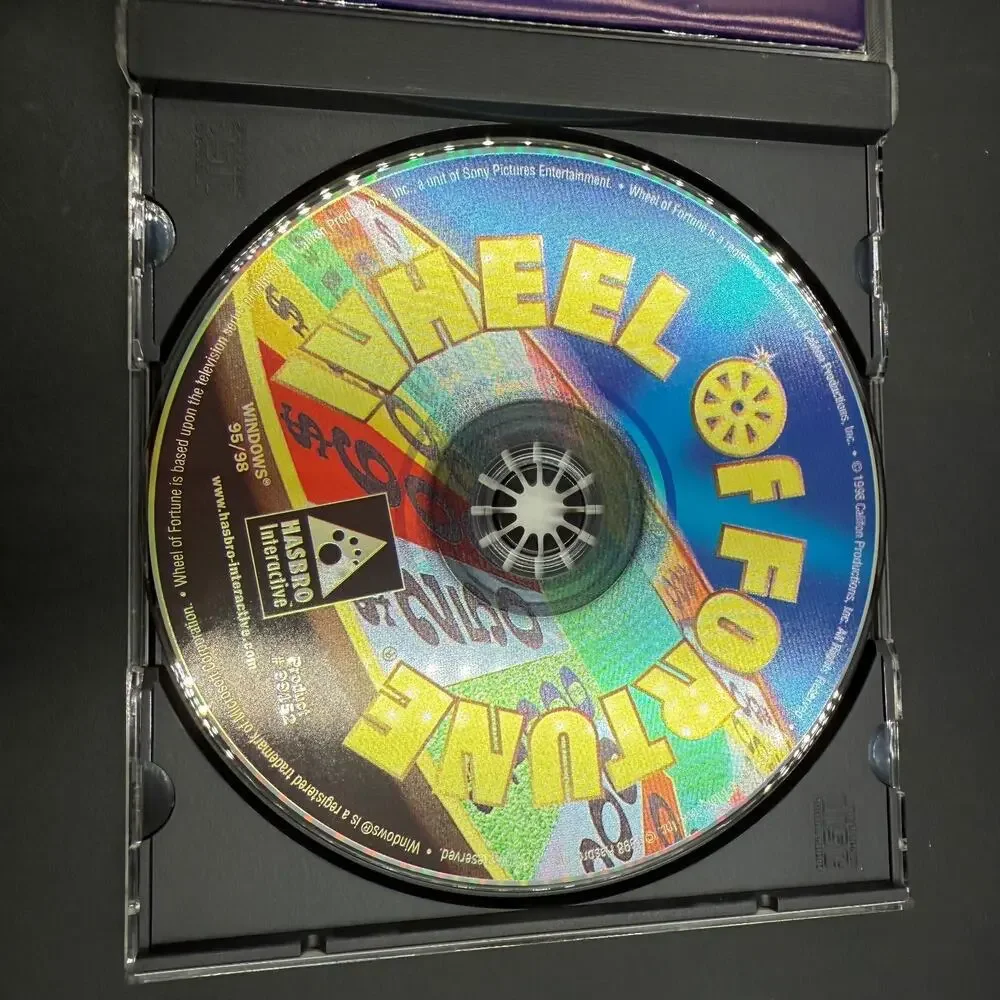 PC Mixed Game Lot of 4 Solitaire Wheel of Fortune Prime Suspects Trophy Bass